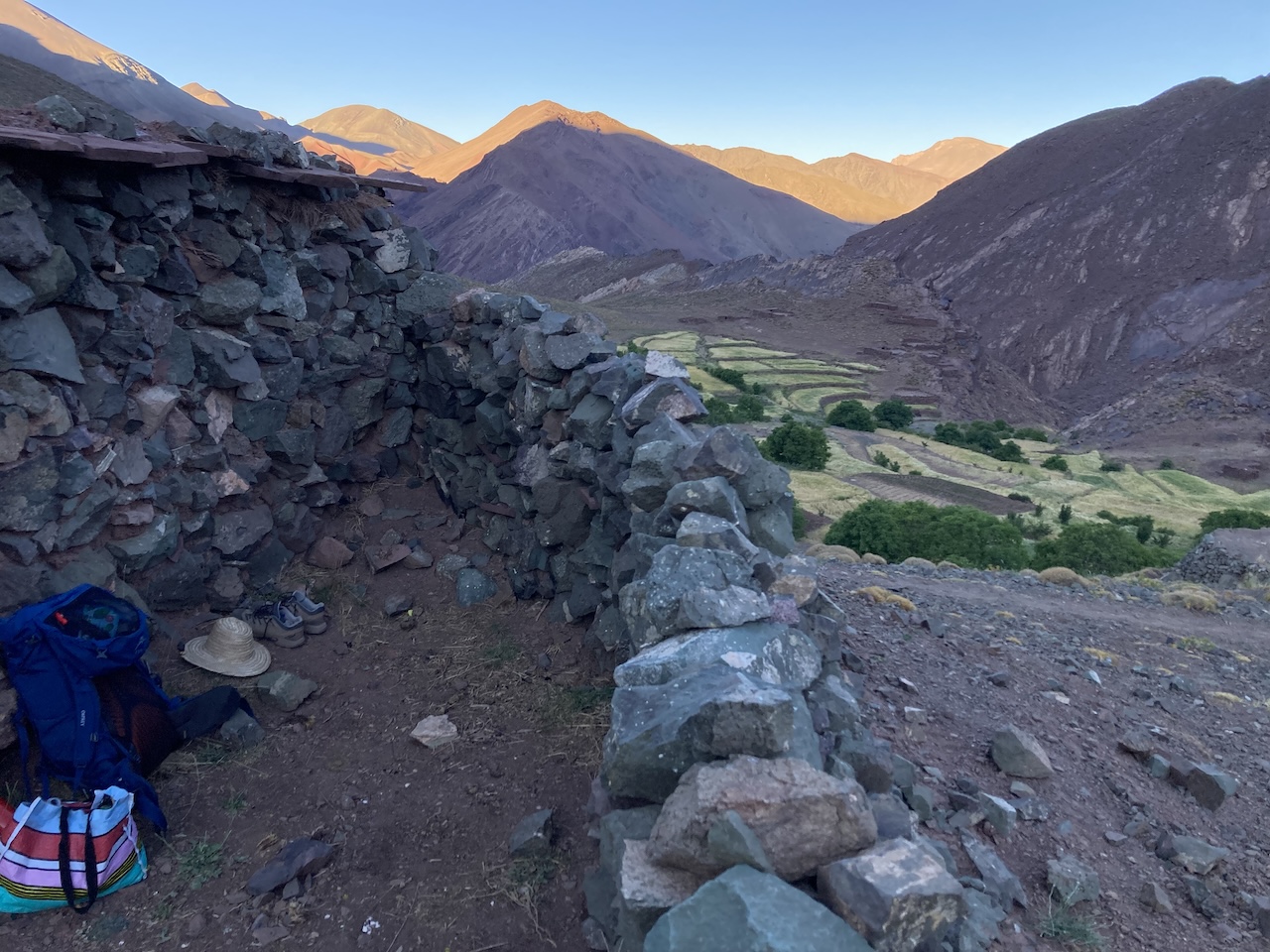 a person sitting in a stone wall